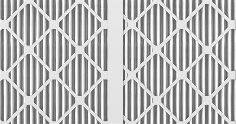 Geometric pattern of interlocking diamond shapes with vertical lines, creating a modern, textured design in silver and white.
