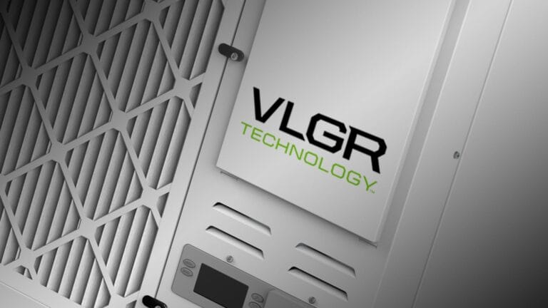 Close-up of a metallic panel featuring the logo "VLGR TECHNOLOGY" with a textured, hexagonal background.